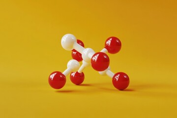 A group of red and white spheres on a yellow surface, perfect for science or technology illustrations