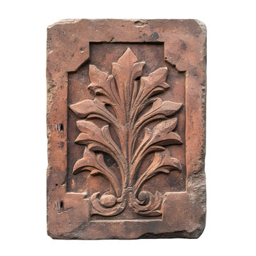 An intricate terracotta relief featuring a floral design, showcasing craftsmanship and artistry in muted earthy tones.