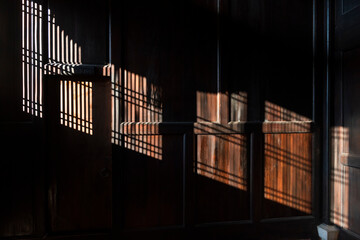Intricate Light and Shadow Patterns in a Wooden Interior Room