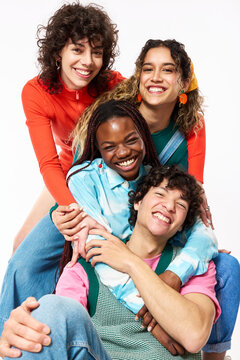 Cheerful multiethnic friends hugging