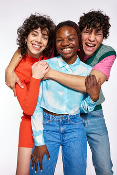 Happy diverse friends embracing