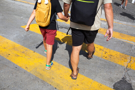 Father and son walking by the Porto city streets 