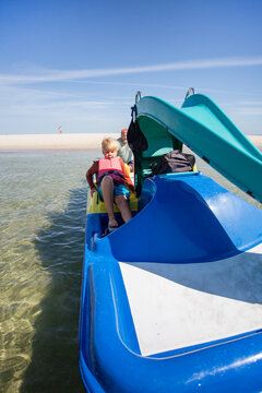 family having fun on catamaran ride