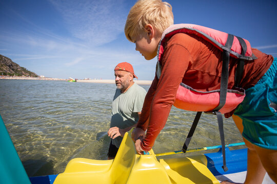family having fun on catamaran ride