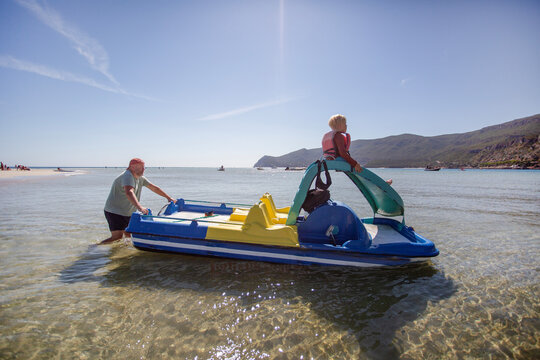 family having fun on catamaran ride