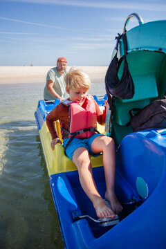 family having fun on catamaran ride