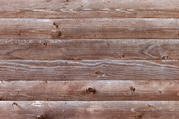 Rustic wooden planks arranged horizontally showcasing natural grains