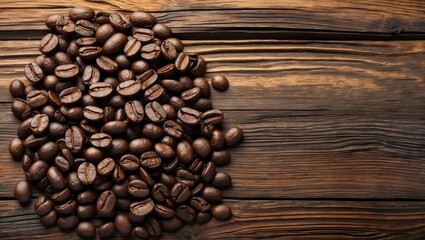 Dark roasted coffee beans scattered on a textured wooden background, creating a natural space on the right for text or design elements.