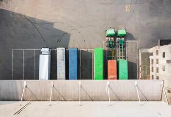 Semi-Trucks and Shipping Containers in Logistics Yard