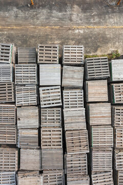 Overhead View of Stacked Wooden Pallets in Warehouse