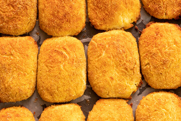 Cottage cheese pancakes on a baking sheet.Dessert.Syrniki