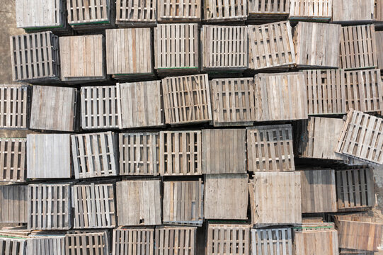 Overhead View of Stacked Wooden Pallets in Warehouse