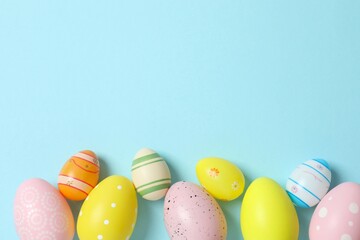 Fototapeta premium Happy Easter. Colorful eggs on color background, space for text or advertising