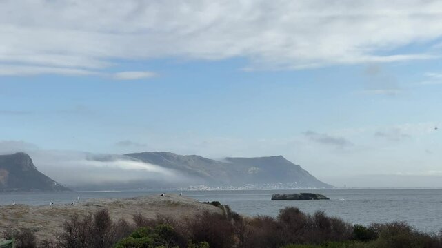View across False Bay from Simonstown looking towards the Muizenberg Mountains and Silvermine, outside of Cape Town.