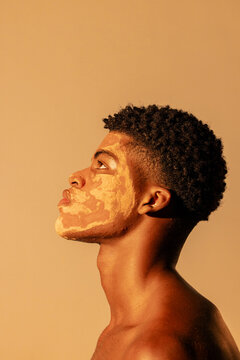 close up of man using clay on face for skin care