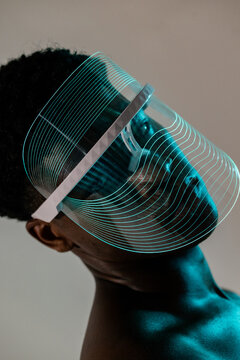 Close-Up of LED Face Shield with Teal Glow