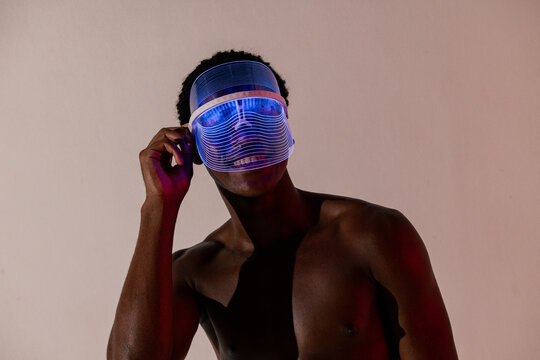 Man in LED Face Shield with Neon Glow