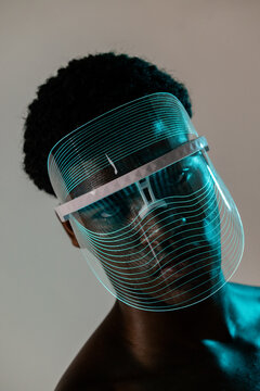 Close-Up of LED Face Shield with Teal Glow