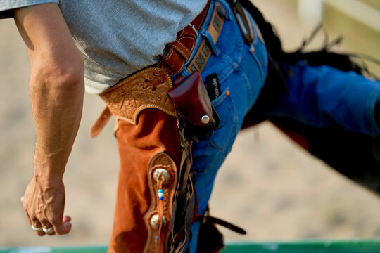 Close-up of a cowboy wearing chaps and a holster on a sunny day. Brandenburg, Germany