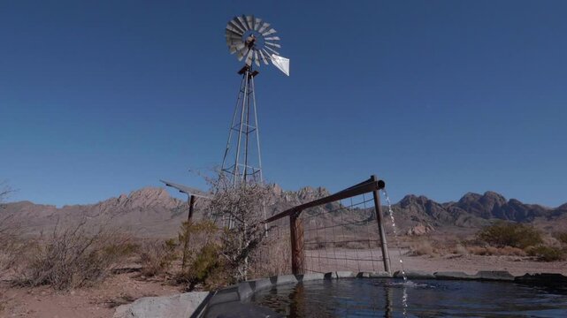 Windmill Pumping Water in the High Desert in NM