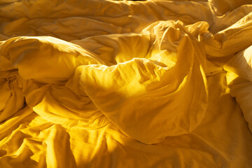 Sheets on an empty bed.