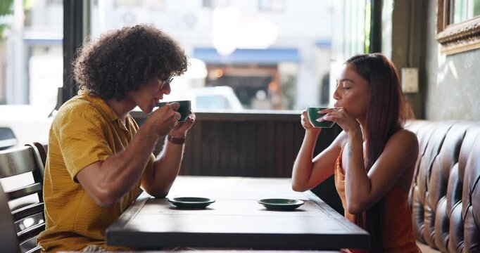 Morning, cheers and couple with coffee in cafe for relax on weekend in restaurant for connection. Calm, happy and woman with man enjoying cup of organic chai, matcha or tea latte in diner for energy.