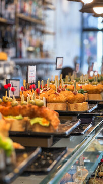 Variety of Spanish tapas served on plates in local bar in Barcelona
