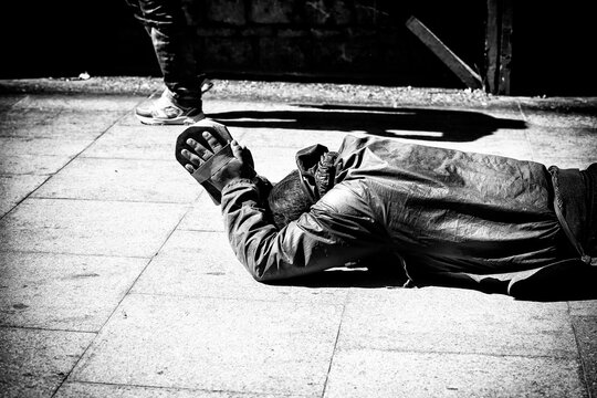 A devoted Tibetan pilgrim prostrating on the way to the Potala Palace in Lhasa, showcasing deep spirituality, faith, and perseverance on a sacred Buddhist journey