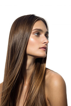 A profile of a young woman with long, shiny hair, softly illuminated against a black background, highlighting her serene expression and natural beauty.