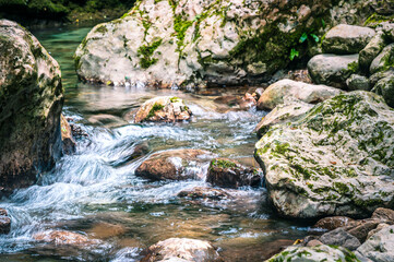 Immersion in the greenery. Kobarid natural waterfalls of Kozjak. Wonder of nature