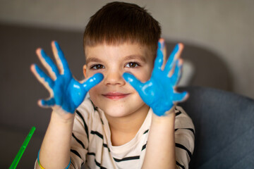 child with painted hands