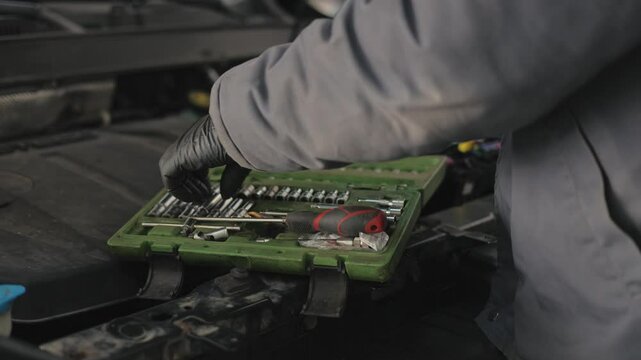 Replacement and repair of auto engine control unit chips.A set of different car keys.Box with keys for car repair
