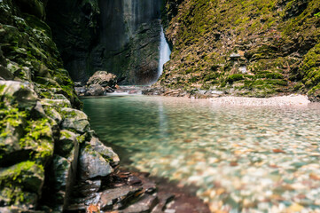 Immersion in the greenery. Kobarid natural waterfalls of Kozjak. Wonder of nature