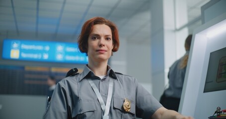 Airport Security Checkpoint: Portrait of Female Security Officer Smiling, Looking at Camera....