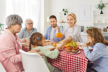 Happy big family people common meal three generation gathering, grown up adult children, senior grandparents, kids at home holiday together, homemade food, talking, laughing, enjoying leisure time 