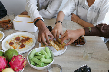 People Enjoying Various Food Served on The Dining Table During Ramadan Kareem