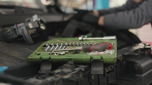 Replacement and repair of auto engine control unit chips.A set of different car keys.Box with keys for car repair
