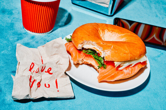 crumpled paper napkin with the text I love you on a table