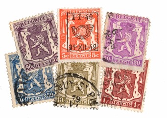 A set of antique postage stamps from Belgium featuring a lion.