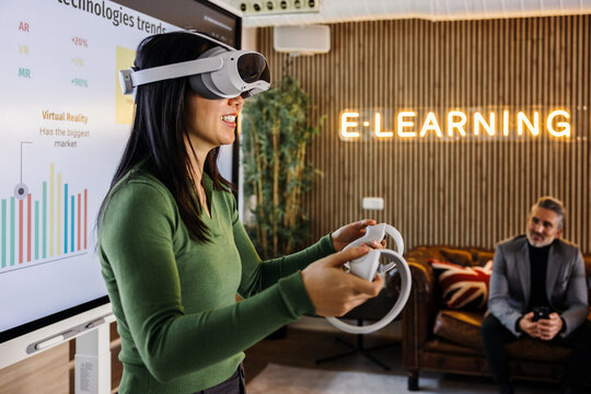 Asian woman in interactive e-learning session with VR headset