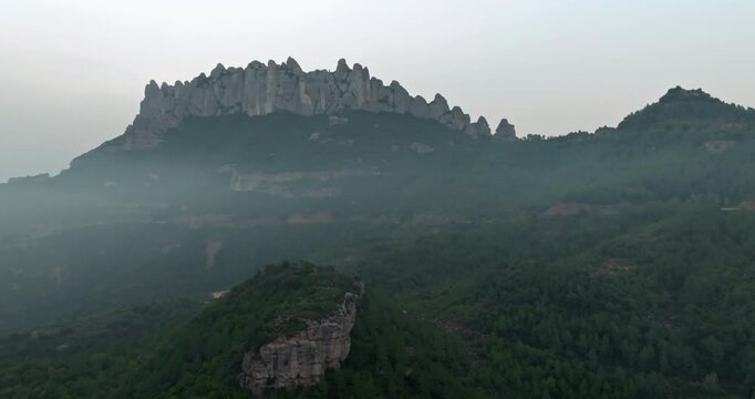 A fabulous sunrise in the fog between mountain ranges in Spain.