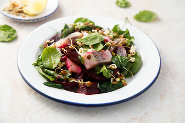 Herring salad with beetroot and spinach