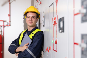 Control Room Engineer. Power Plant Control Panel. Engineer standing in front of the control panel...