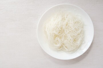 Glass Noodles in white plate on white background, thai called wun sen   © Meowwelove