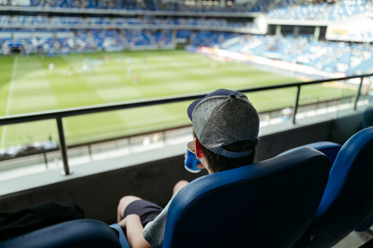 Young Fan Enjoying a Thrilling Match From Above