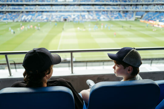 Two Young Fans Enjoying the Excitement of a Game
