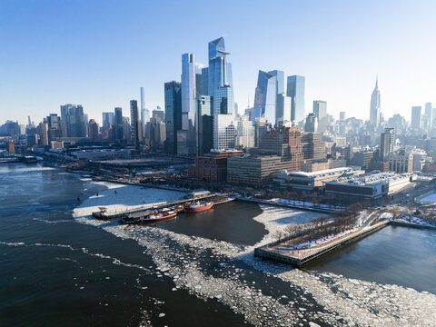 NYC Skyline and river with frozen patches and ships