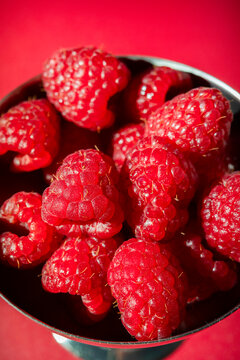 Macro Shot of Fresh Raspberries in a Metal Cup