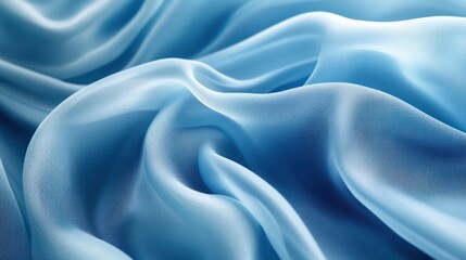 Fototapeta premium Blue silk fabric draped, studio shot, textile background, fashion design