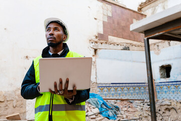 A building inspector assesses the damage at a construction site